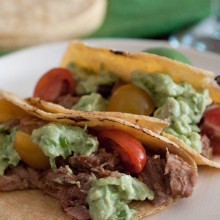 Sweet Pulled Pork Tacos with Avocado Cream on ASpicyPerspective.com from Gaby Dalkin #avocados #tacos