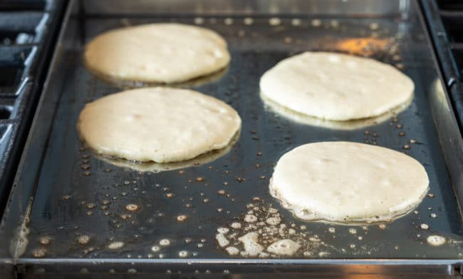 Pancake batter poured onto griddle.