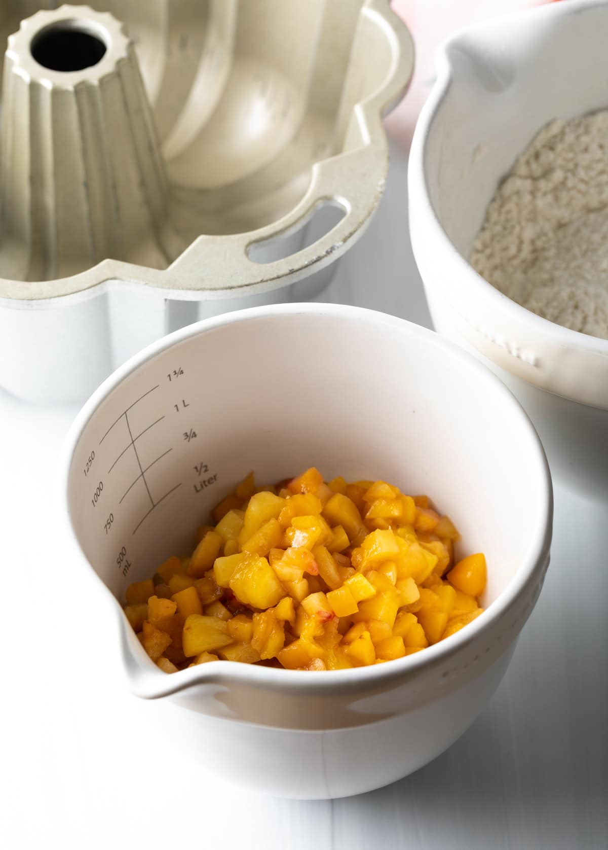 Diced peaches in a bowl.