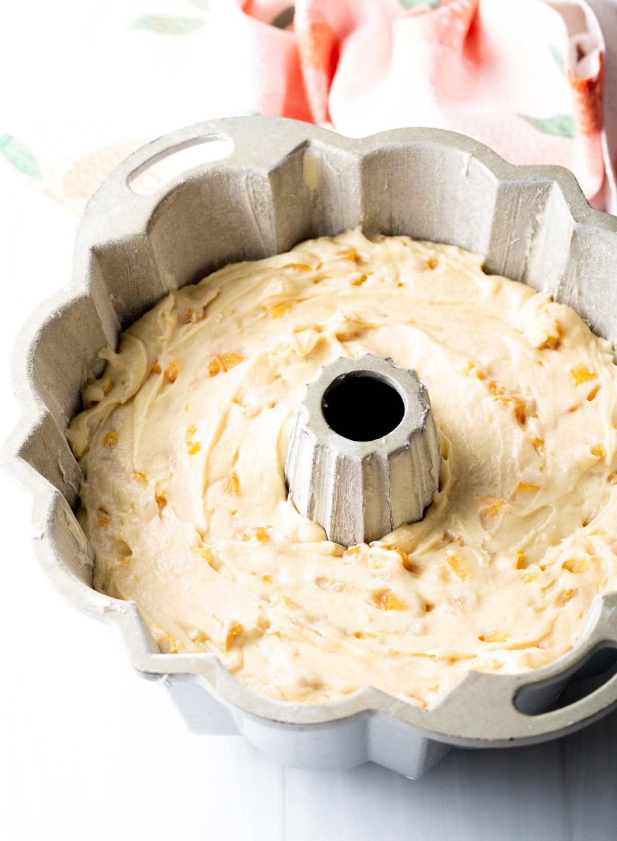 Bundt pan filled with cake batter.