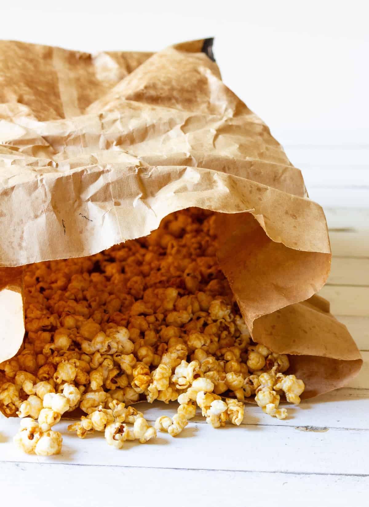 caramel popcorn made in the in a brown paper bag