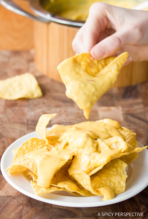 Cheese sauce makes or breaks any nacho recipe. The Best Queso recipe is easy and flavorful, with sharp and smoky notes. Start dipping those tortilla chips! #ASpicyPerspective #Queso #Cheese #Dip 