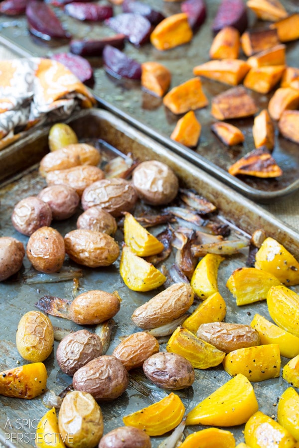 Roasted root vegetables on baking sheets.