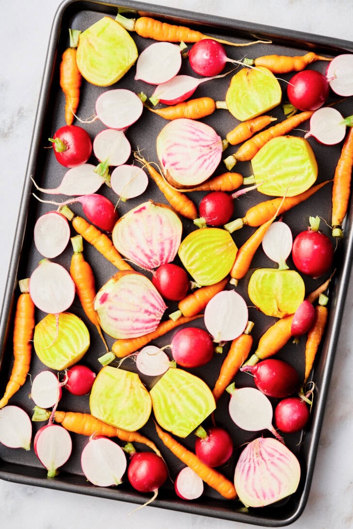cut vegetables on a sheet pan