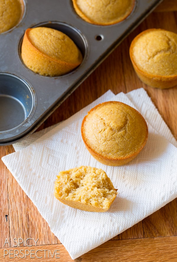 Cornbread Muffins broken open to show soft center