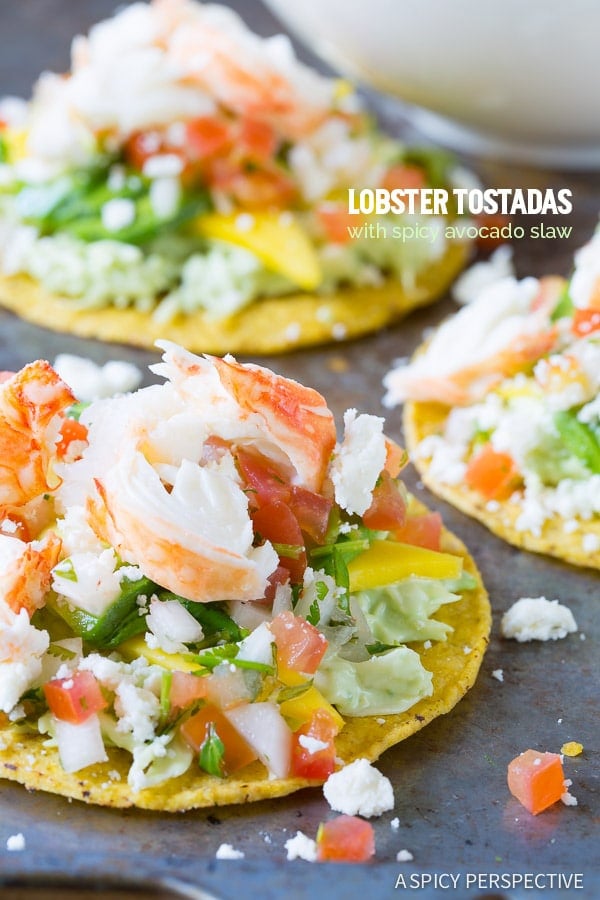 3 lobster tostadas on gray slate.