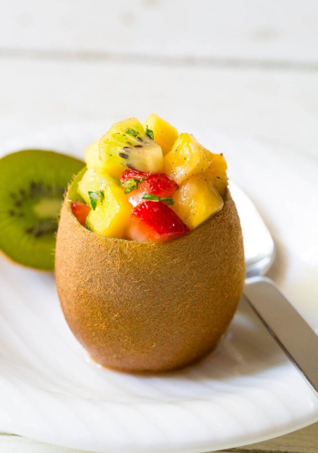 Easy Tropical Fruit Salad in Kiwi Cups on ASpicyPerspective.com 