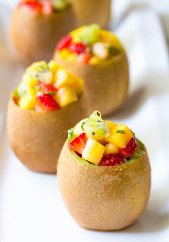 Tropical Fruit Salad in Kiwi Cups on ASpicyPerspective.com