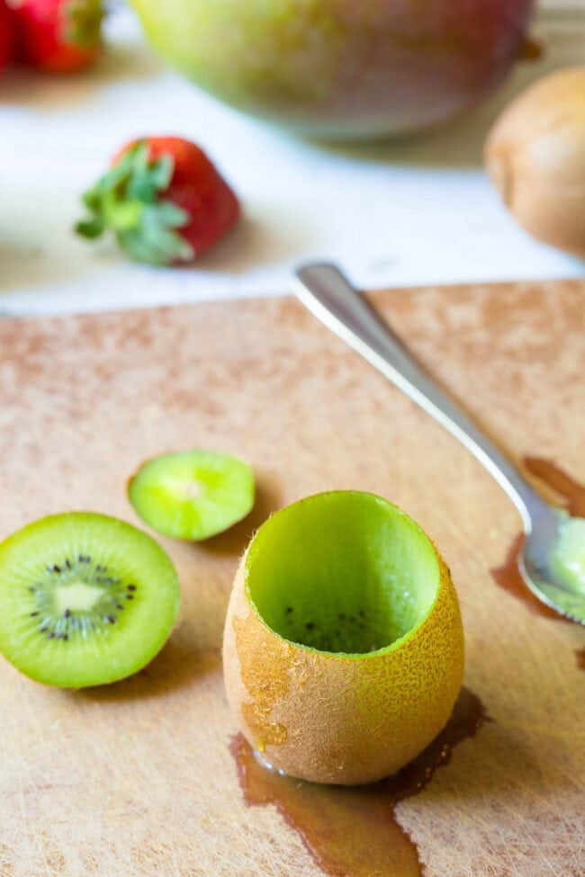 How to Make Fruit Salad in Kiwi Cups on ASpicyPerspective.com - fruit cups with peel