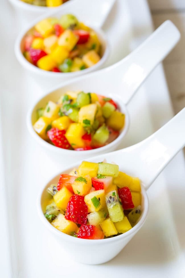 The Best Tropical Fruit Salad in Kiwi Cups on ASpicyPerspective.com - in ceramic cups