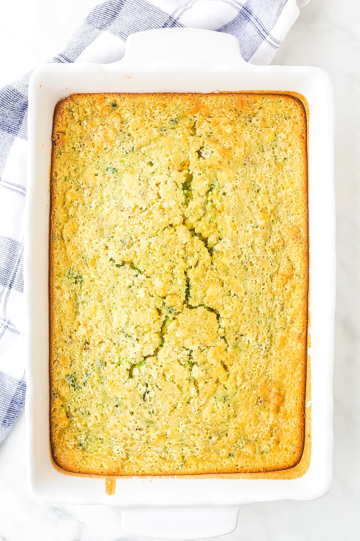 Top view of final corn pudding recipe in a casserole dish 
