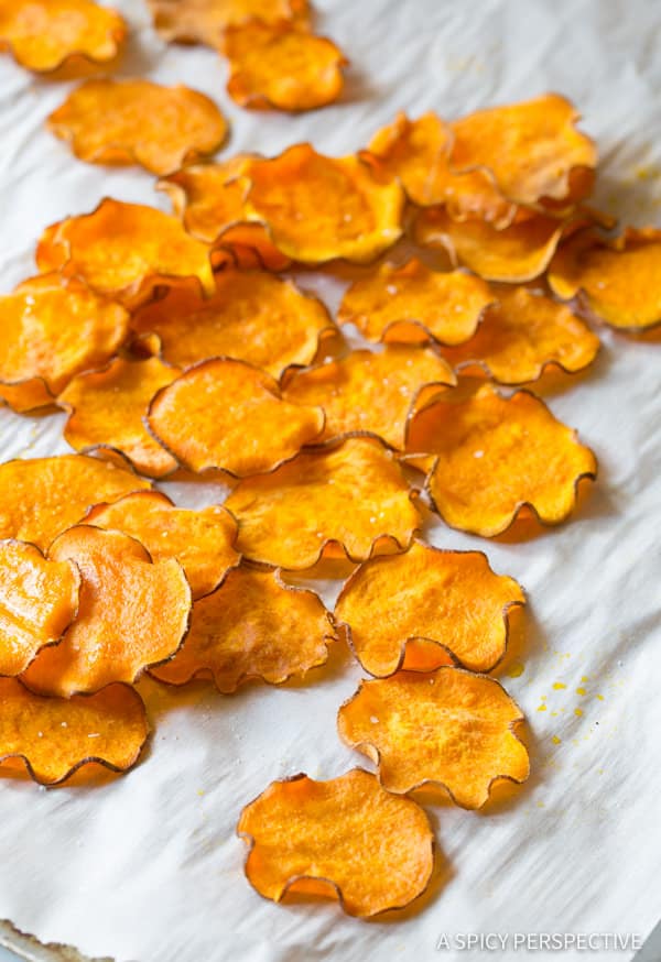 Baked Sweet Potato Chips Recipe - This simple 3-ingredient recipe makes a fabulous healthy snack & side dish. Learn how to make sweet potato chips at home! #ASpicyPerspective #healthy #chips #sweetpotato #snacks #bakedchips