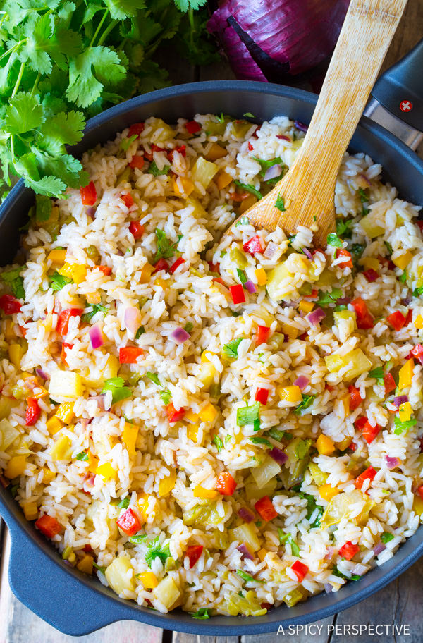 Caribbean Confetti Rice #ASpicyPerspective #Rice #Caribbean #CaribbeanRice #CaribbeanRiceRecipe #ConfettiRice #SideDish #Jalapenos #Pineapple #BellPeppers #CoconutMilk