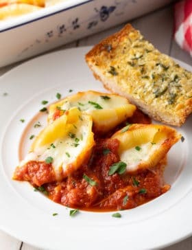 How To Make Ricotta Stuffed Shells Recipe #ASpicyPerspective #stuffed #shells #ricotta #holiday #italian #comfortfood #pasta #baked #slowcooker #crockpot