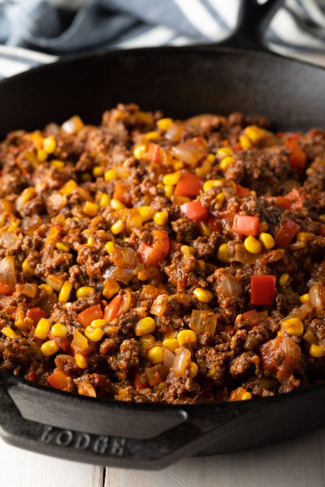 Ground beef filling for tamale pie in a skillet. 