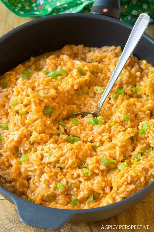 Top down view cheesy enchilada rice in a pot.