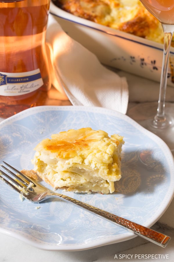 Plated strukli with a fork and a bite removed. 