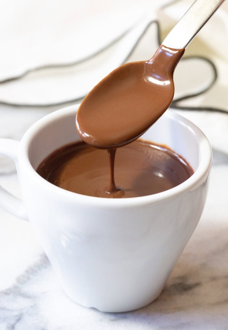 Easy French Hot Chocolate Recipe (Drinking Chocolate) in small white cup with spoon