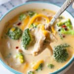 chicken broccoli soup in bowl with spoon