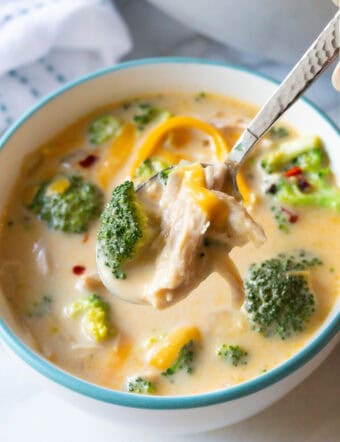 chicken broccoli soup in bowl with spoon