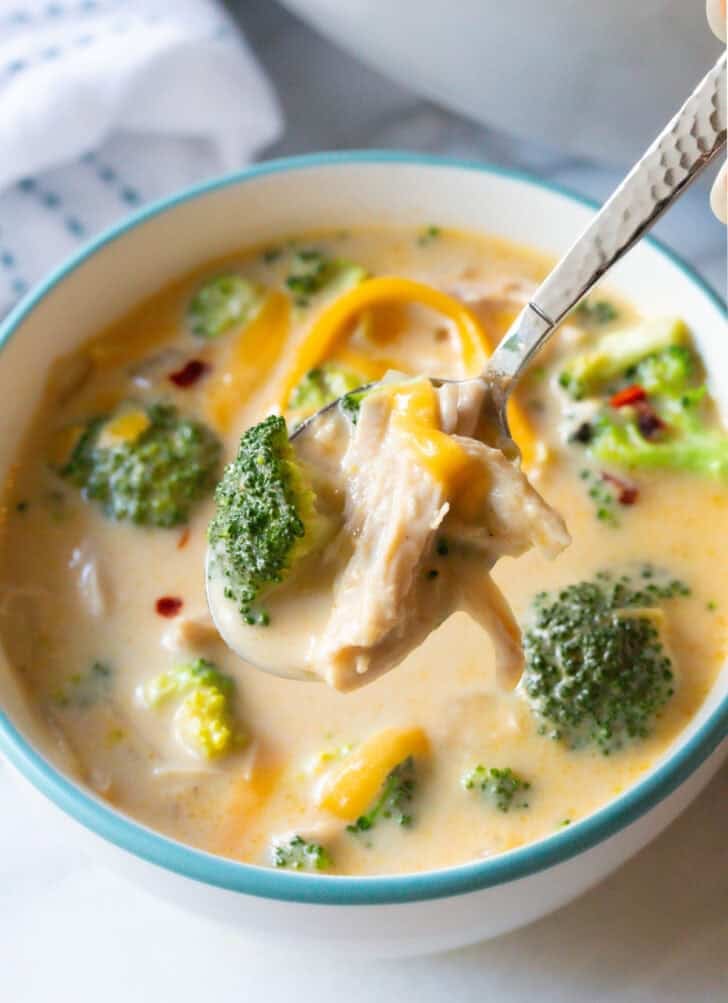 chicken broccoli soup in bowl with spoon