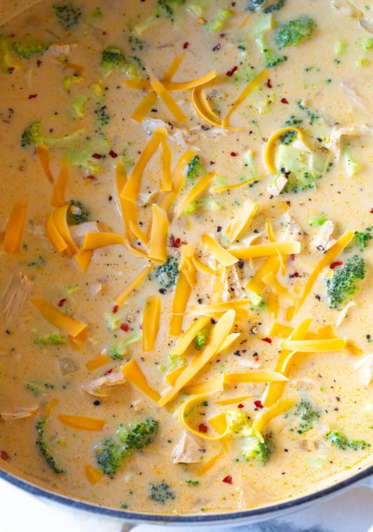 creamy chicken broccoli soup in large white pot