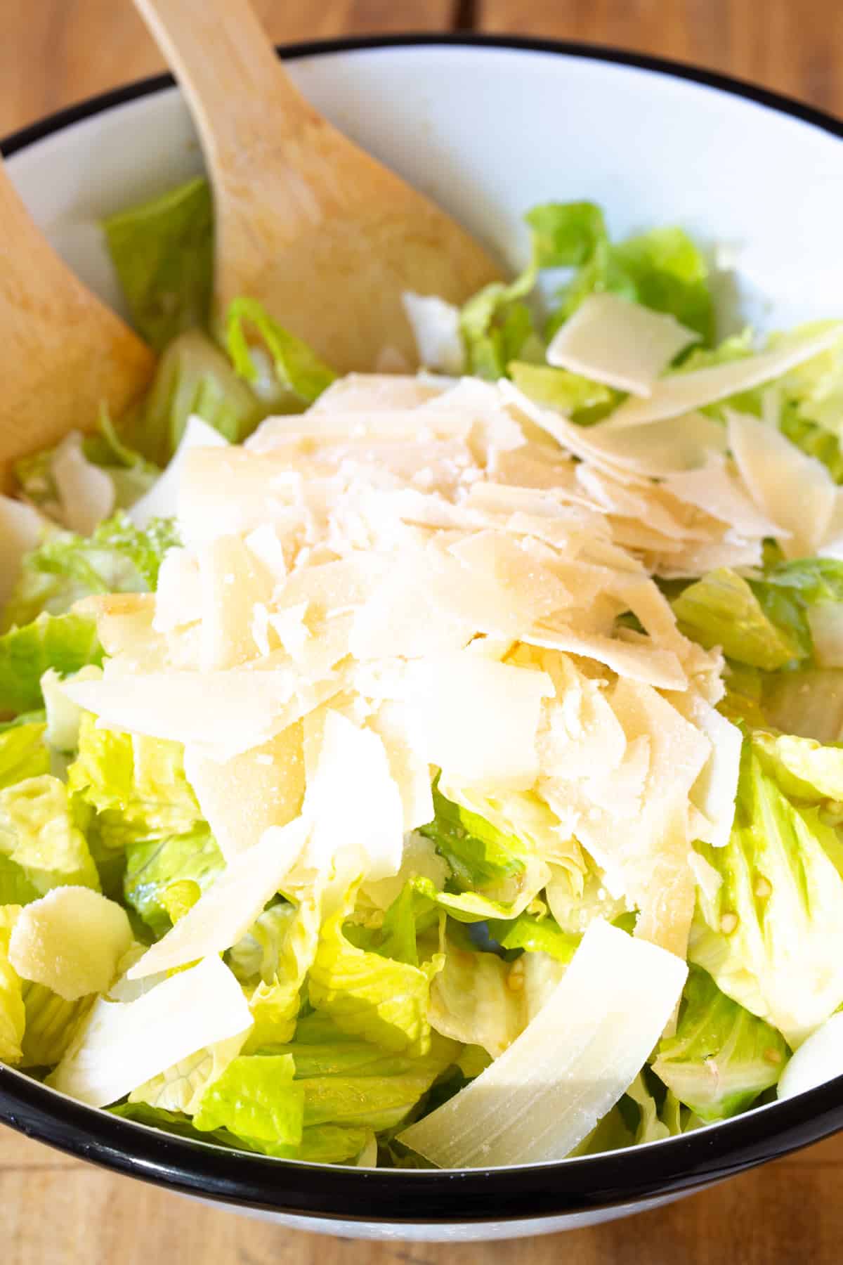 Parmesan shavings placed on top of salad. 