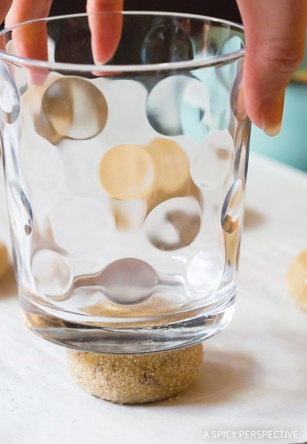 Cup pressing down cookie.