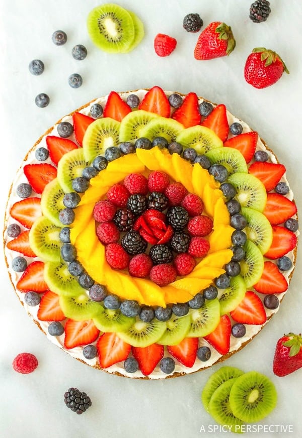Overhead view of colorful vegan fruit pizza.