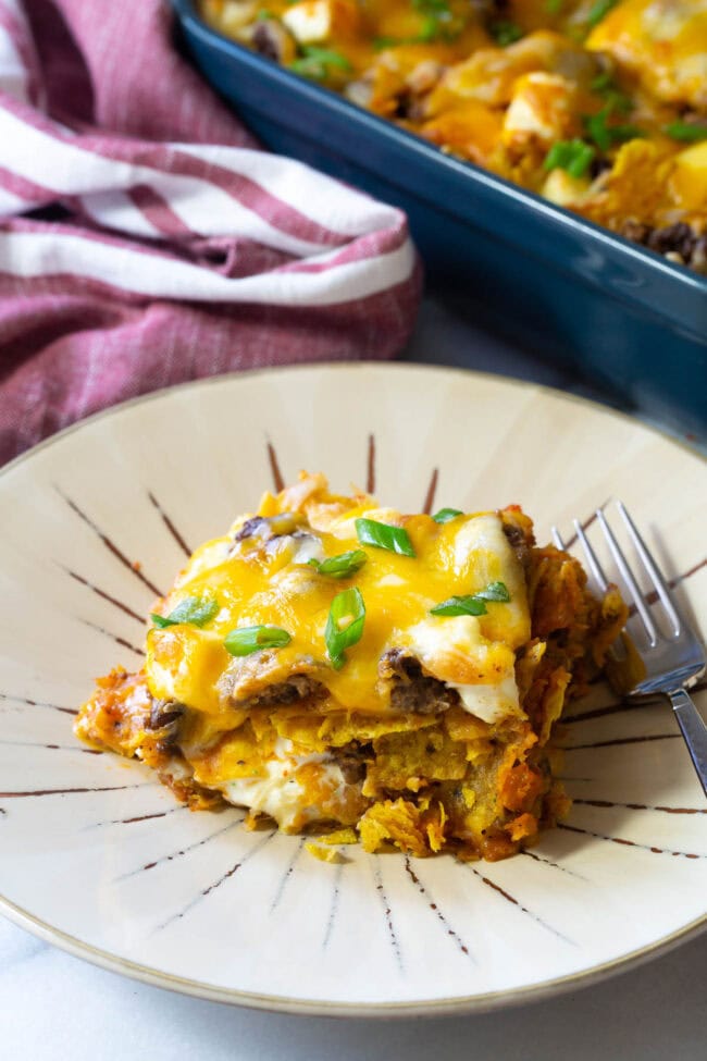 A piece of cool ranch dorito lasagna on a plate.