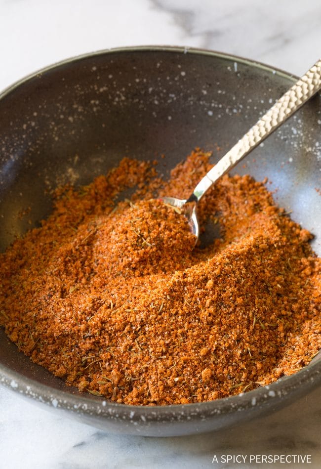Steak seasoning in a small bowl with a little spoon. 