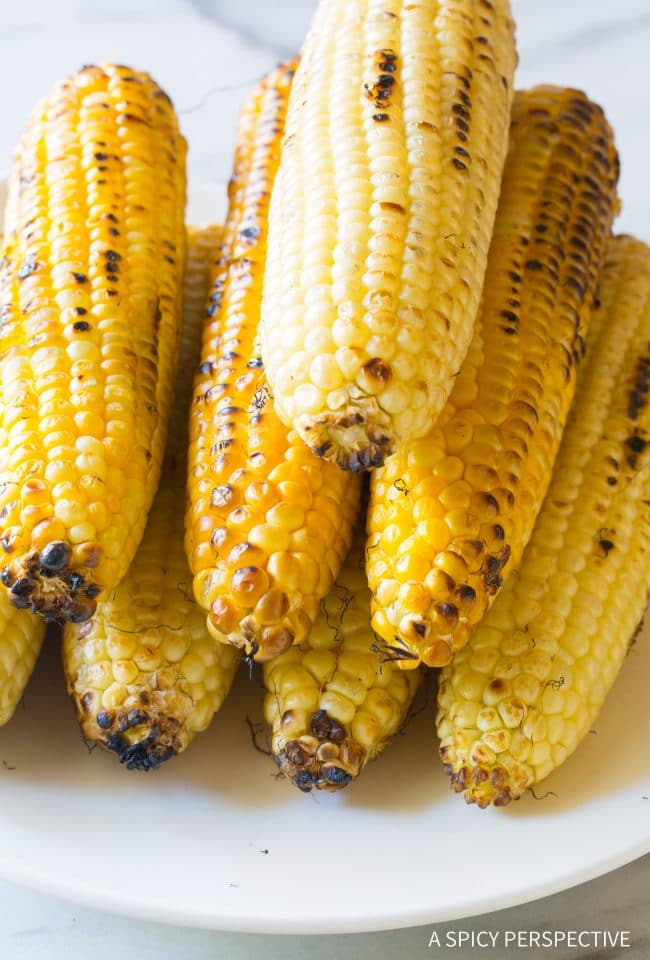 Stack of grilled corn on the cob.