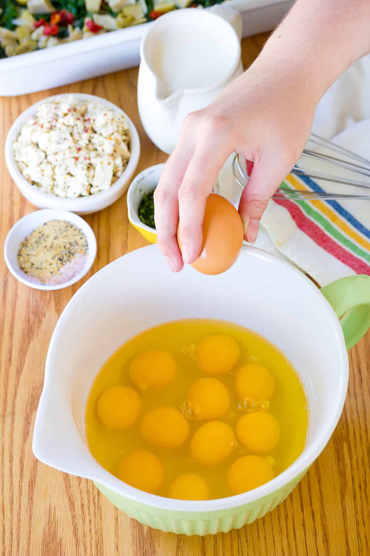 cracking eggs for breakfast casserole