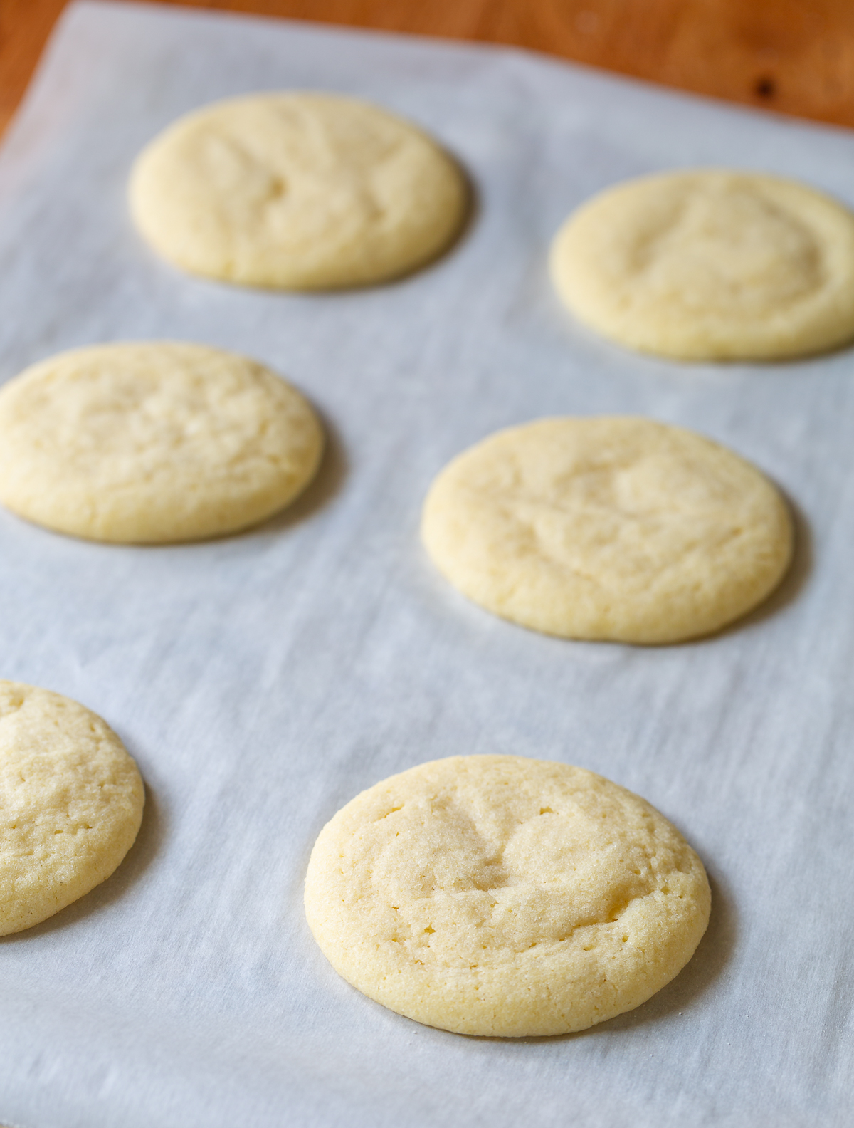 Side view of best sugar cookie recipe on parchment paper