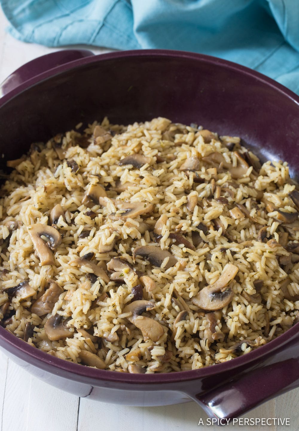 Cooked rice pilaf with mushrooms in a pan. 