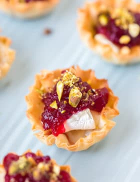 Easy Baked Brie Bites with Cranberry Sauce Recipe #ASpicyPerspective #brie #baked #cranberry