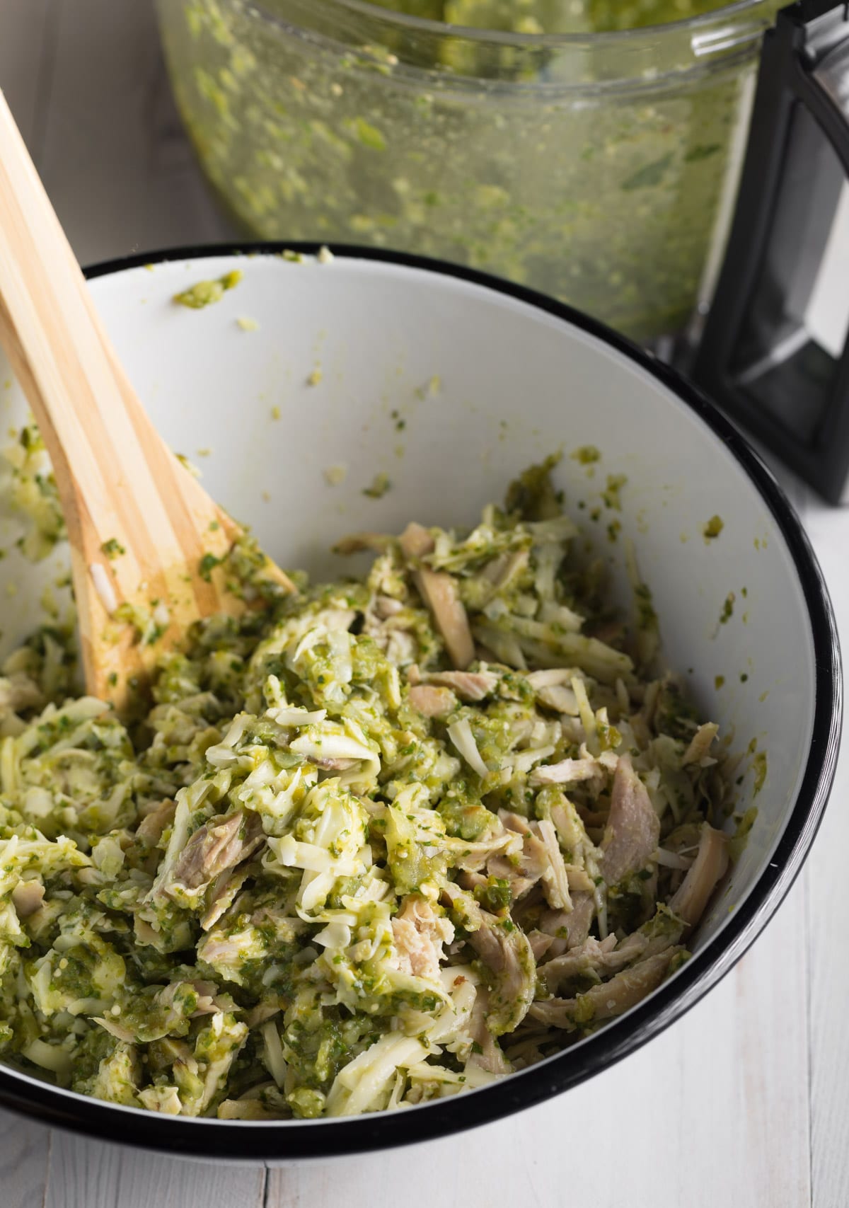 Bowl filled with cheesy chicken mixture. 