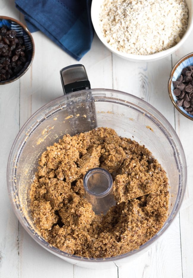 Crumbled energy ball dough in a food processor.