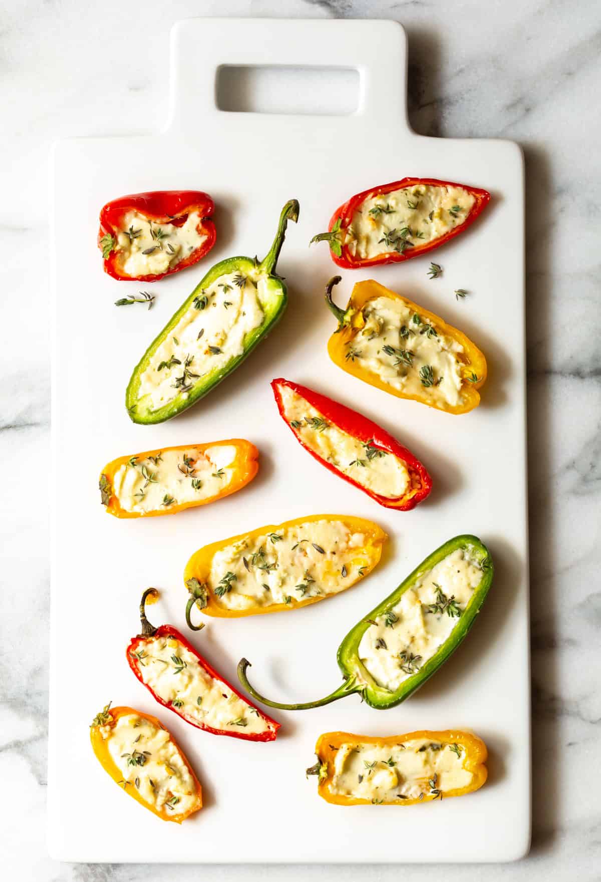 mini stuffed peppers on a white serving tray