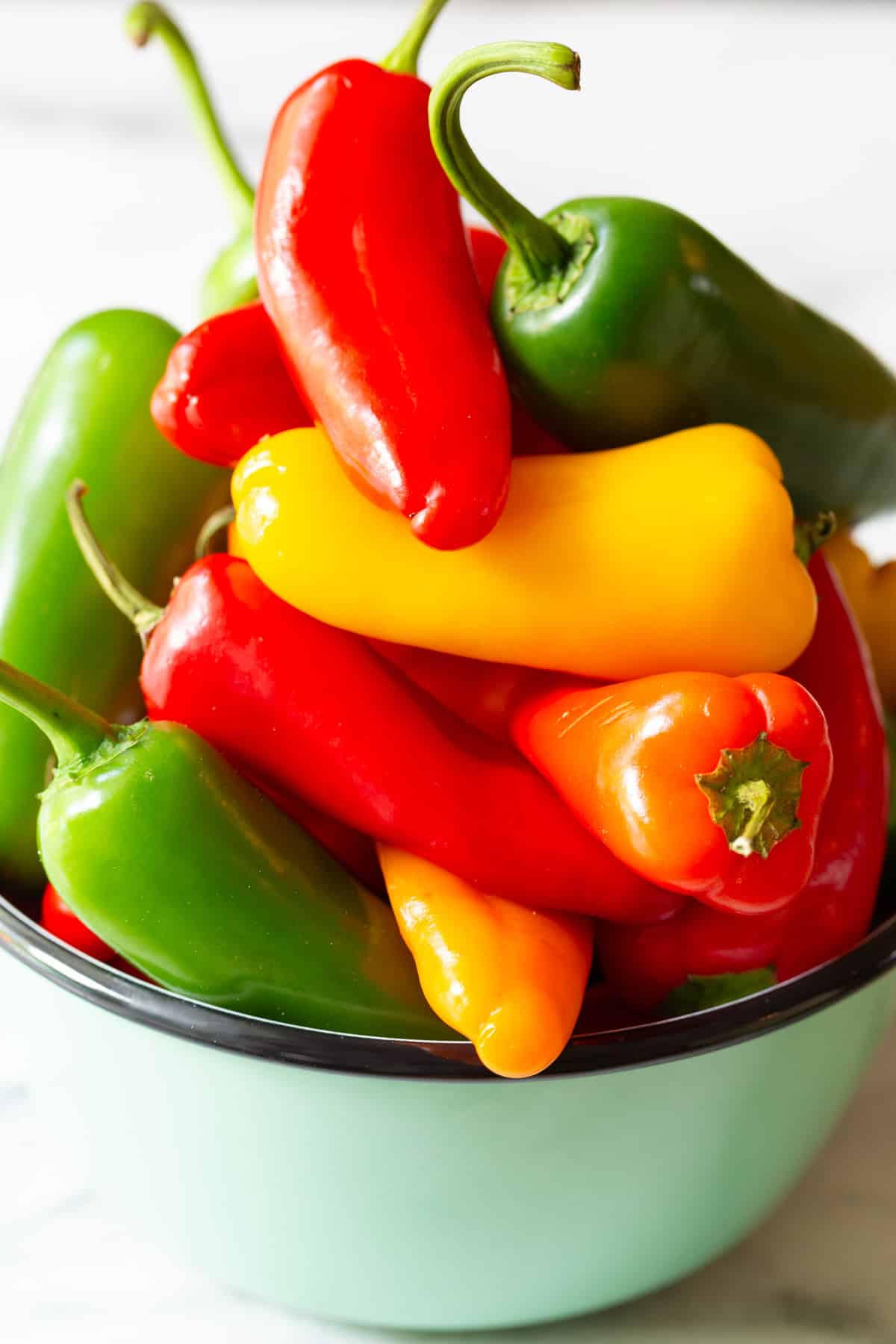 mini bell peppers piled in a bowl
