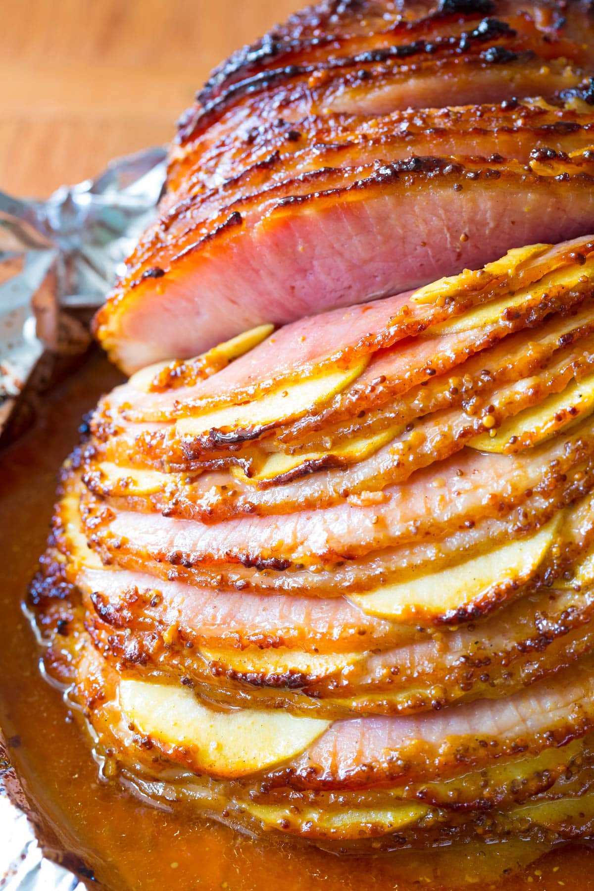 Closeup of spiral ham stuffed with apples.