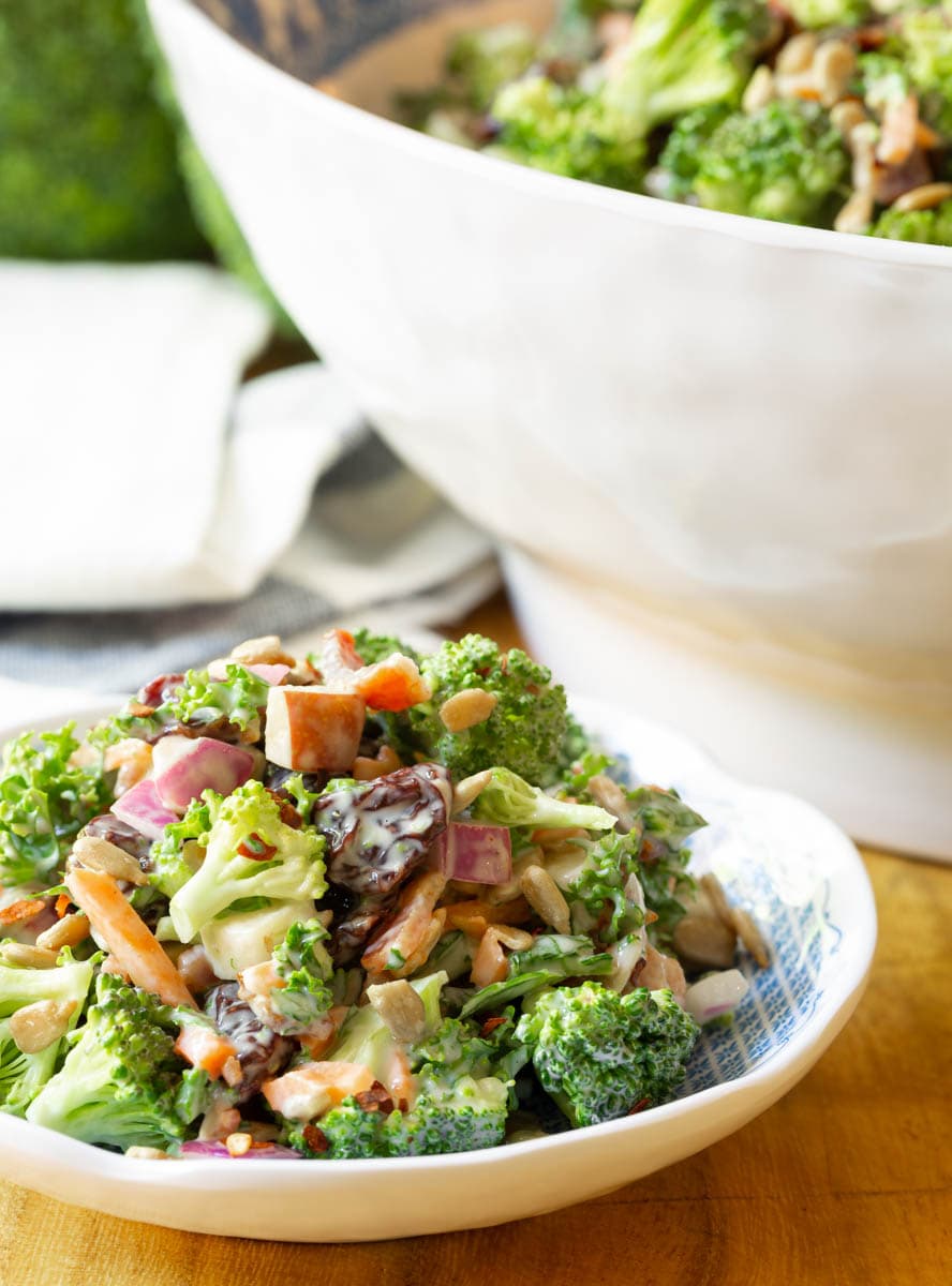 Side view of broccoli salad in a bowl.