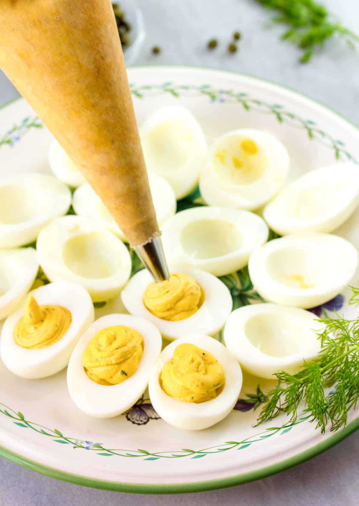piping yolk filling into egg whites