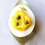 deviled egg recipe - one piece resting on spoon