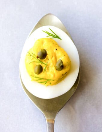 deviled egg recipe - one piece resting on spoon