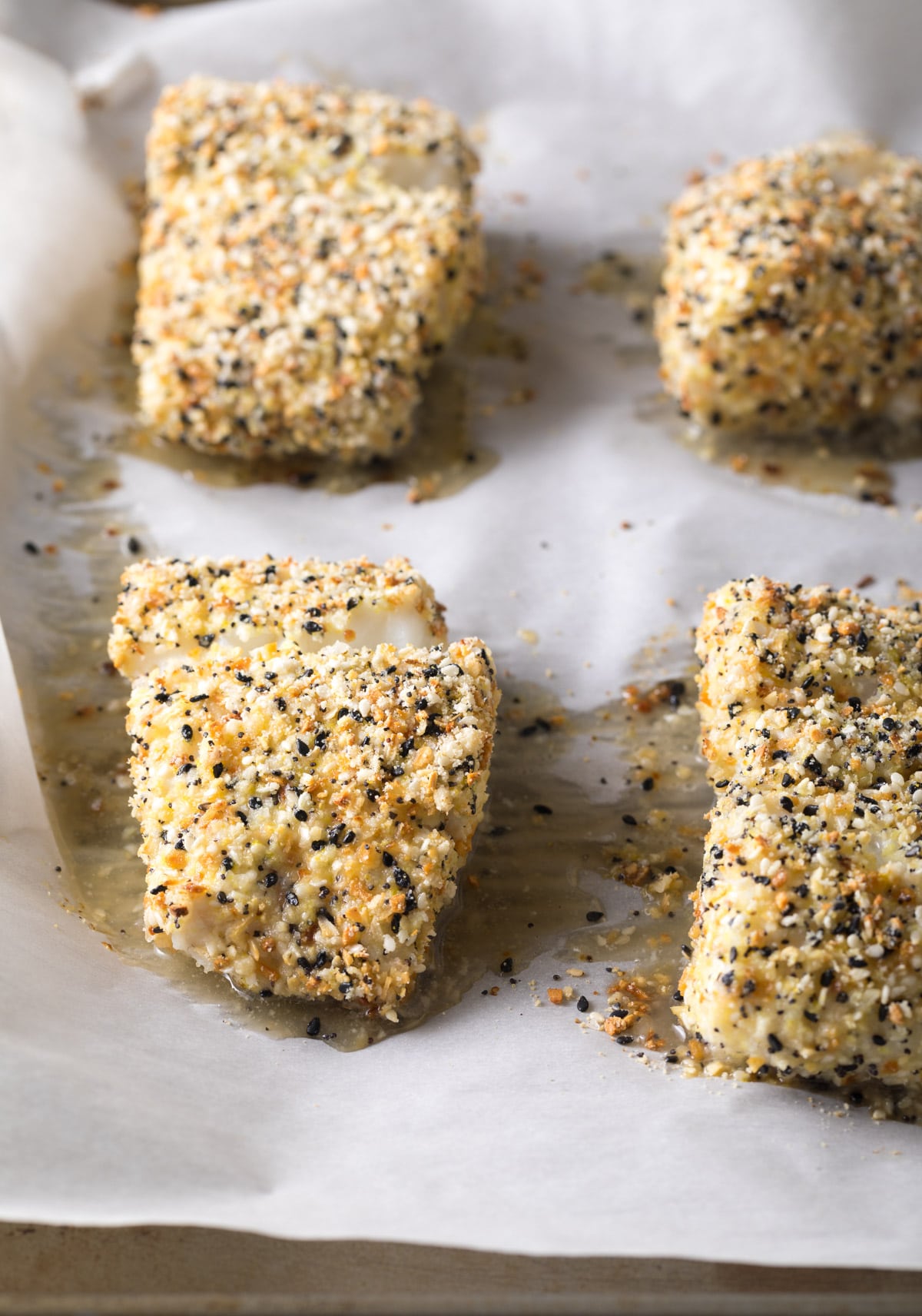 Baked cod fillets on a baking tray. 