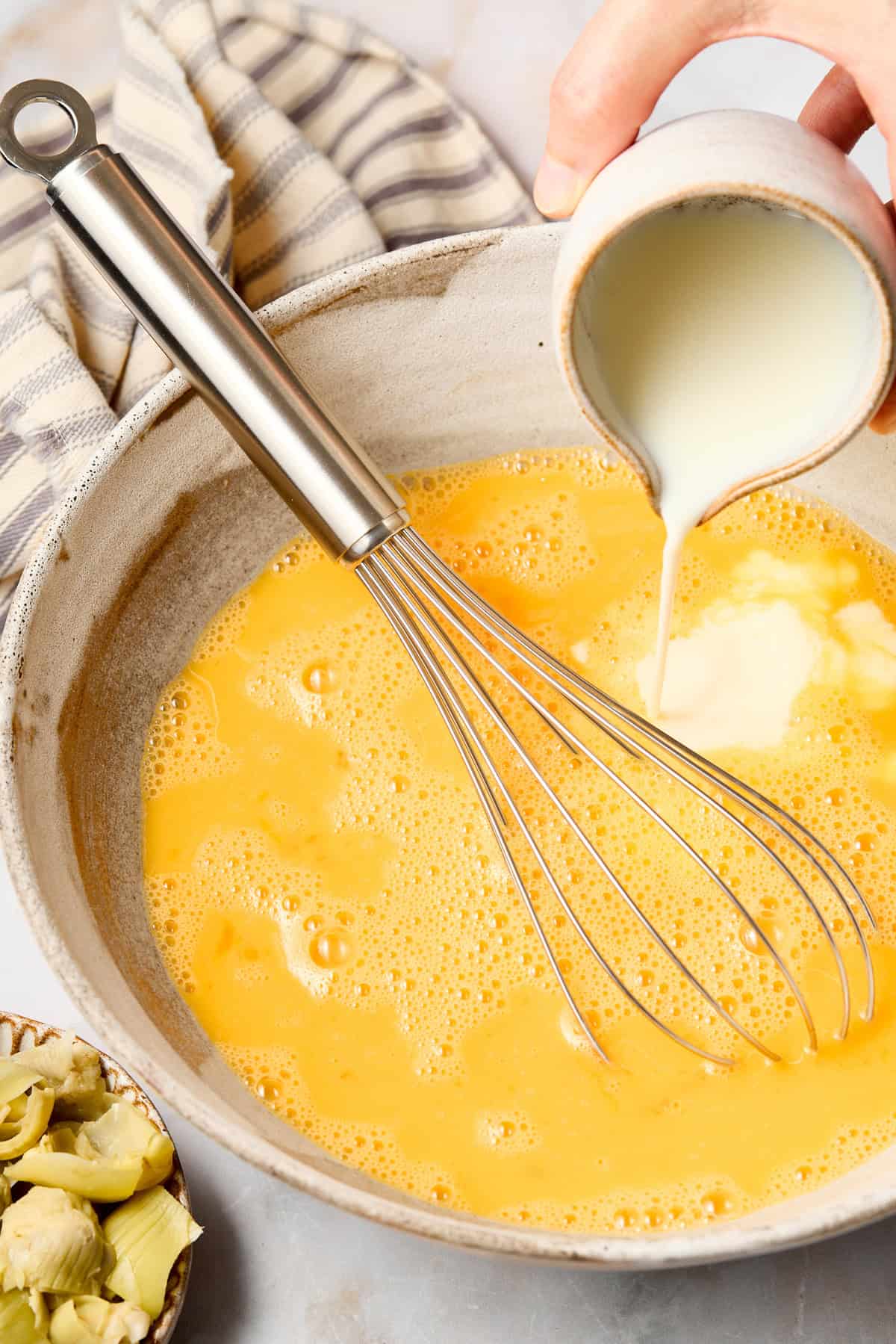 Making egg casserole - mixing ingredients in bowl