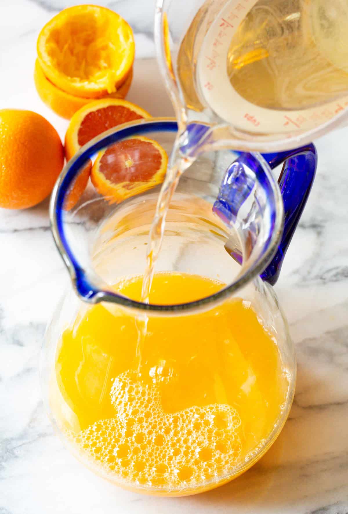 adding simple syrup to pitcher