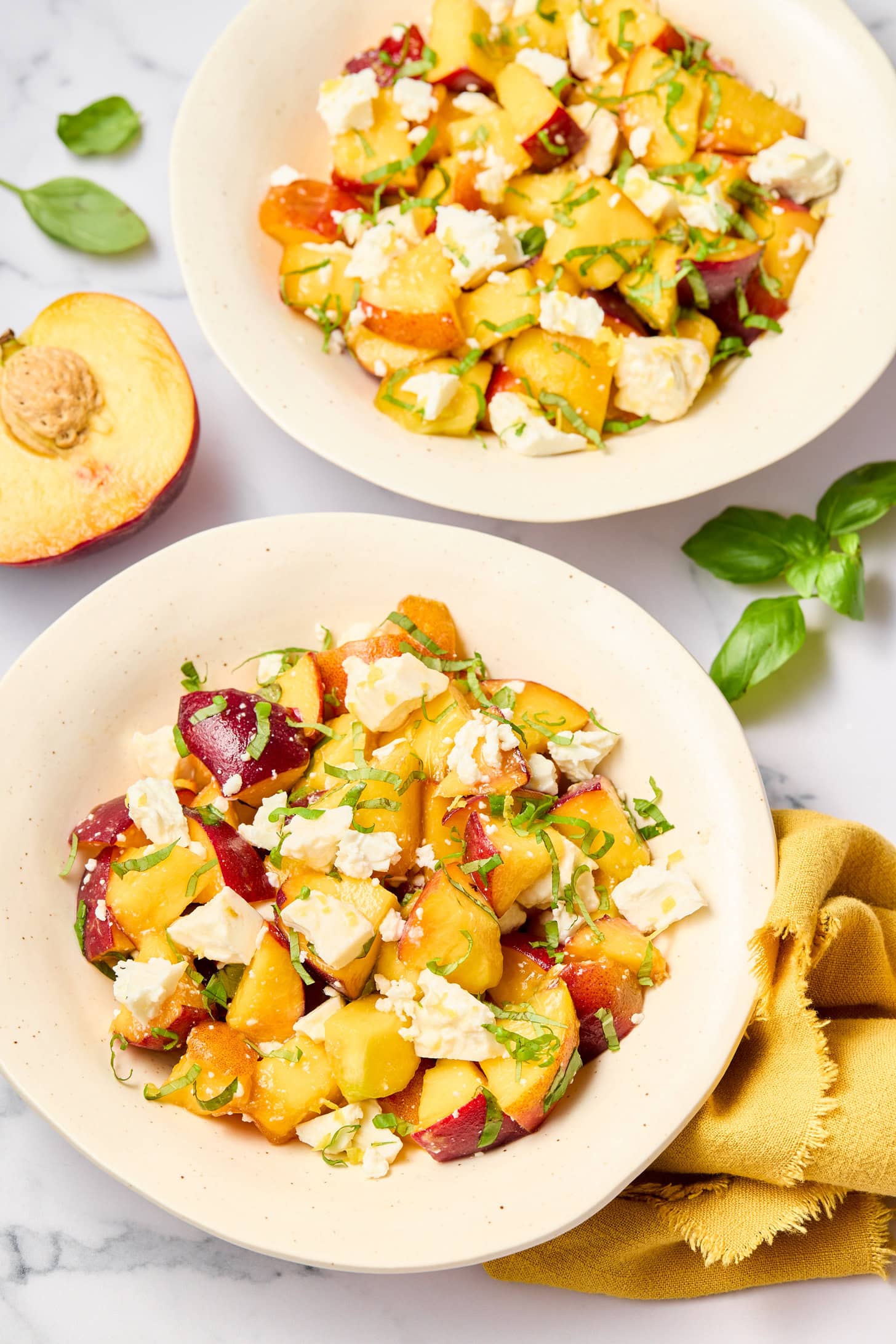 Fresh Peach and Basil Salad in bowls with ingredients