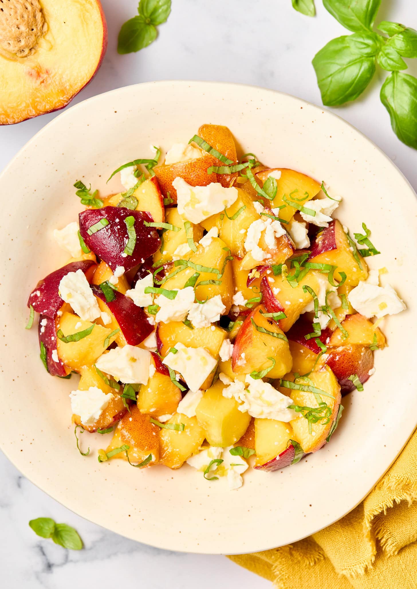 Basil Peach Salad in a bowl.